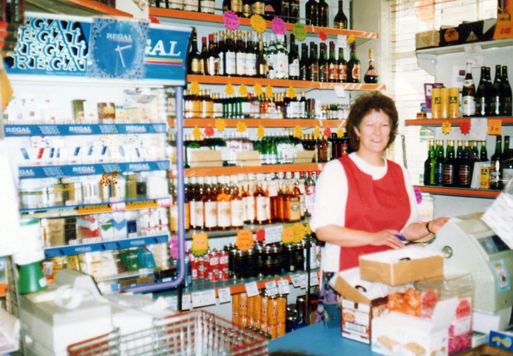 Margaret Sharp behind the counter in Matheson's shop