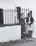 Woman talking outside Hugh Millers Cottage